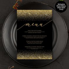 a black and gold wedding menu card on a plate with confetti sprinkles