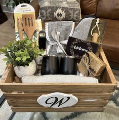 a wooden crate filled with kitchen items on top of a rug