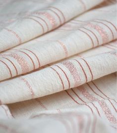 pink and white fabric with stripes on it