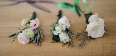 three small bouquets of white and pink flowers