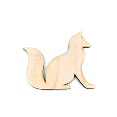 a wooden cutout of a dog on a white background