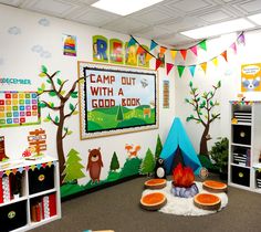 a classroom with colorful decorations and bookshelves on the walls, including a camp out sign