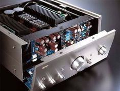 the inside of a stereo amplifier with its electronic components in it's back compartment