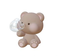 a brown teddy bear with a bubble in its mouth