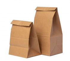 two brown paper bags sitting next to each other