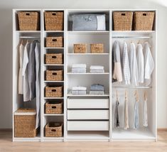 an organized closet with baskets and clothes