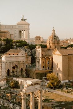 an aerial view of the roman forum and its surrounding buildings, including two large columns