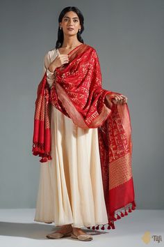 "A timeless dupatta with a mantra handwoven in elegant golden zari. Raw and beautiful - so appealing in its textured appearance and perfect in its imperfections!\n\n\n\n Color\u00a0- A beautiful shade of Maroon with the textured appeal of natural fabric.\n\n\n Technique\u00a0- Classic handwoven Banarasi art passed down through generations\n\n Fabric\u00a0- Textured in appearance, pure Dupion silk\n\n\n Speciality\u00a0- An unusual script pattern, chic and traditional at the same time.\n\n Tilfi Shades Of Maroon, Dupion Silk, Katan Silk, Silk Suit, Natural Fabric, Fashion Attire, Indian Fashion Dresses, Raw Silk, Natural Fabrics