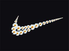 a necklace with daisies hanging from it's side on a black background,