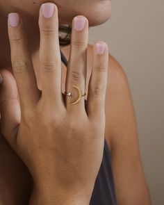 Want to capture the beauty of the moon and stars for yourself? This open ring is exactly what you need! This smooth, sleek ring is made of sturdy sterling silver. You'll be sure to shine just like a star when you're wearing this! Materials: 14K gold plated sterling silver or sterling silver Features: 1mm band, 4mm star, 17mm crescent moon, Lead & Nickel free, open band- allows for minor adjustments Moon Phase Open Ring, Celestial Open Ring With Moon Charm, Celestial Moon Midi Rings As Promise Ring, Celestial Moon Midi Rings For Promise, Celestial Moon-shaped Midi Promise Rings, Moonstone Open Ring With Moon Phase Detail, Dainty Jewelry Open Ring With Moon Phase, Moon Phase Open Ring For Promise, Dainty Moon Phase Open Ring Jewelry