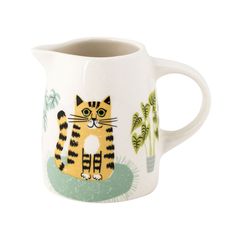 a coffee cup with a cat design on it