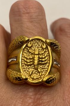 Vintage Scorpio scorpion ring with snakes size 10 Fine details worked into the stainless steel casting. plated with Asian 22k yellow gold accents and clear crystals Steel rings can not be re sized. All jewelry is shipped in a nice gift box. Check out our over a THOUSAND great reviews Engraving is $4 per letter and is not always perfect depending on the piece. It can take a few days if the jeweler is busy. This is payable to Paypal Judithsltd@gmail.com Claddaugh Ring, Gold Scorpion, Scorpion Ring, Stainless Steel Ring, Clear Crystals, Size 10 Rings, Stainless Steel Rings, Steel Ring, Vintage Yellow