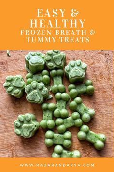 green gummy bears on a cutting board with the words easy & healthy frozen breath and tummy treats