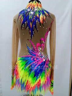 a woman's leotard with colorful feathers and sequins on it