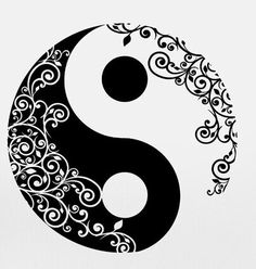 the yin symbol with swirls and dots on it's side, in black and white