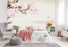 a bedroom decorated in white with pink flowers on the wall and large painting above the bed