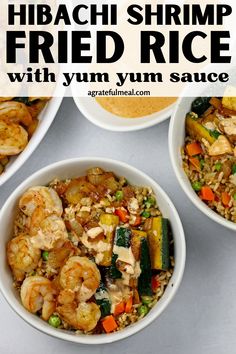 three white bowls filled with shrimp fried rice