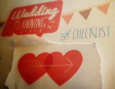 two pieces of paper with hearts and arrows on them that read wedding planning checklist