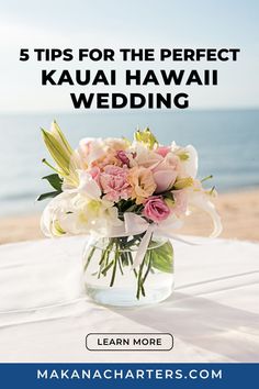 a vase filled with flowers sitting on top of a table next to the ocean and text that reads, 5 tips for the perfect kauai hawaii wedding