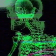 an x - ray image of a skeleton in green and pink colors with glasses on it's head