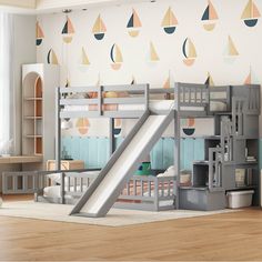 a child's bedroom with bunk beds and a slide