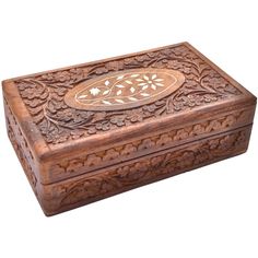 an intricately carved wooden box on a white background