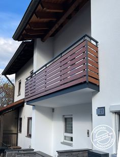 an apartment building with wooden balconies on the balcony