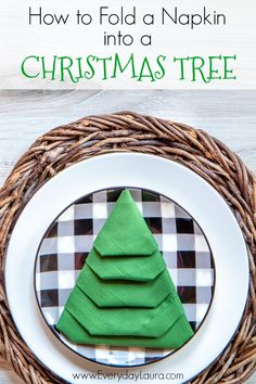 a napkin christmas tree on a plate with the words how to fold a napkin into a christmas tree