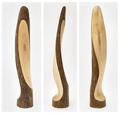 three pieces of wood that have been carved to look like waves