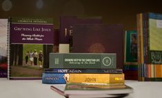 a stack of books sitting on top of a table