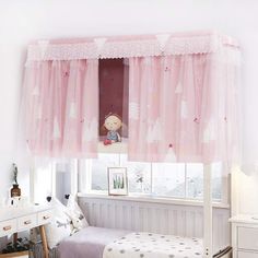 a bedroom with pink curtains and white furniture