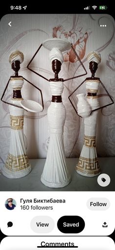 two white vases sitting next to each other