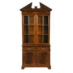 an old wooden china cabinet with glass doors on the front and bottom shelves, in dark wood