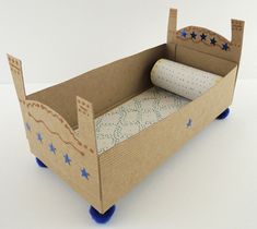 a cardboard box with a roll of toilet paper in it and stars on the side