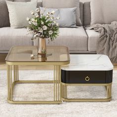 a living room scene with focus on the coffee table and end tables that have flowers in them