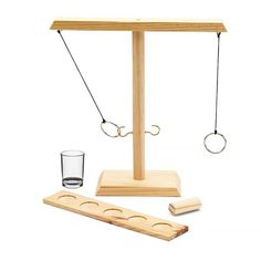 a wooden balance scale with two glasses on it