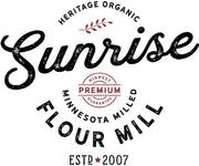 the logo for sunrise flour mill