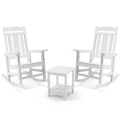 two white rocking chairs and a small table