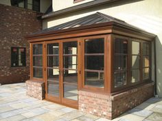 a brick building with glass doors and windows