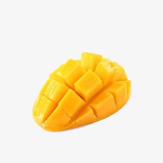 a piece of mango sitting on top of a white surface