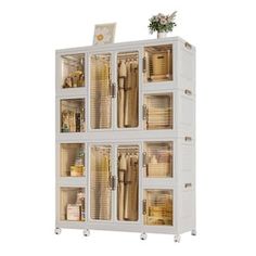 a tall white cabinet filled with lots of drawers