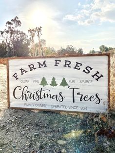 a sign that says farm fresh christmas trees