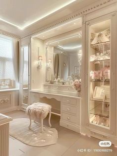 a dressing room with white furniture and mirrors