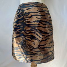 Vintage 1990s animal print mini skirt by Mosskito  MOSSKITO Prét à porter - Discontinued high end clothing brand circa 1980s - 1990s  Unique and beautiful piece from a really interesting vintage brand - Canadian + woman owned  Tiger print faux fur with wavy pattern  Polyester / Cotton blend Zipper closure in back Excellent condition Size M - Fits like modern size S Measurements: Waist 27 in  Hips 37 in Length 17 in 1980s Grunge, Tiger Print Skirt, High End Clothing Brands, Animal Print Mini Skirt, Wavy Pattern, Print Mini Skirt, Lace Straps, Vintage Branding, Tiger Print