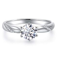 a white gold engagement ring with diamonds on it