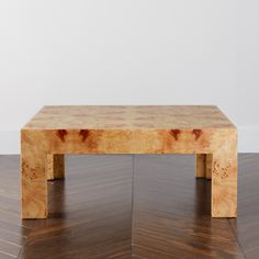 a wooden table sitting on top of a hard wood floor