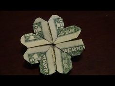 an origami flower made out of one dollar bill