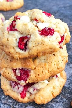 three cookies stacked on top of each other with cranberries and marshmallows