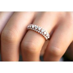 a woman's hand with a diamond ring on it