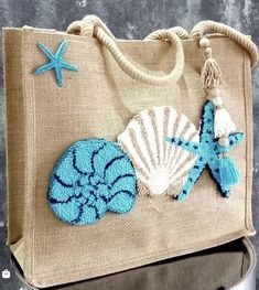 a handbag with shells and starfish on it